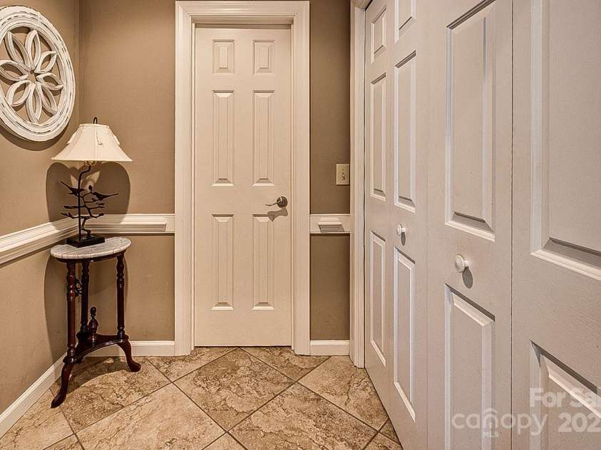 378 Shoreline Drive, New London, NC 28127.  MLS# CAR4246898, YatesRealty ID 6989. Half bath and laundry closet on main floor