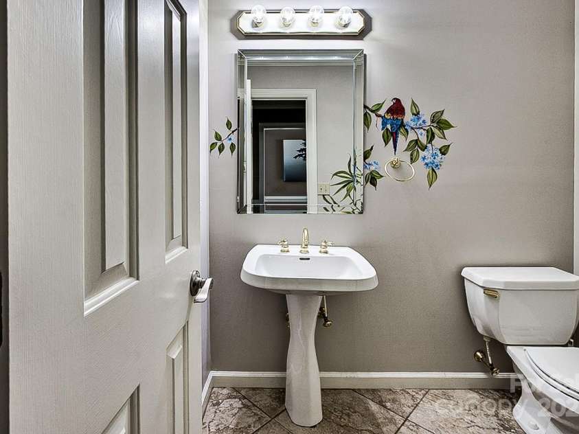 378 Shoreline Drive, New London, NC 28127.  MLS# CAR4246898, YatesRealty ID 6989. Half bath on main floor