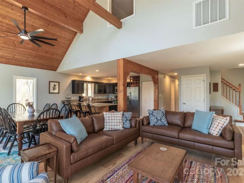 136 Dars Lane, Tuckasegee, NC 28783.  MLS# CAR4248083, YatesRealty ID 699. Living space with wood accents on ceiling