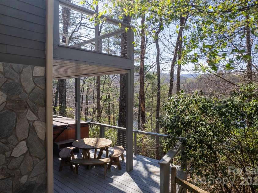 136 Dars Lane, Tuckasegee, NC 28783.  MLS# CAR4248083, YatesRealty ID 699. Side view of both decks