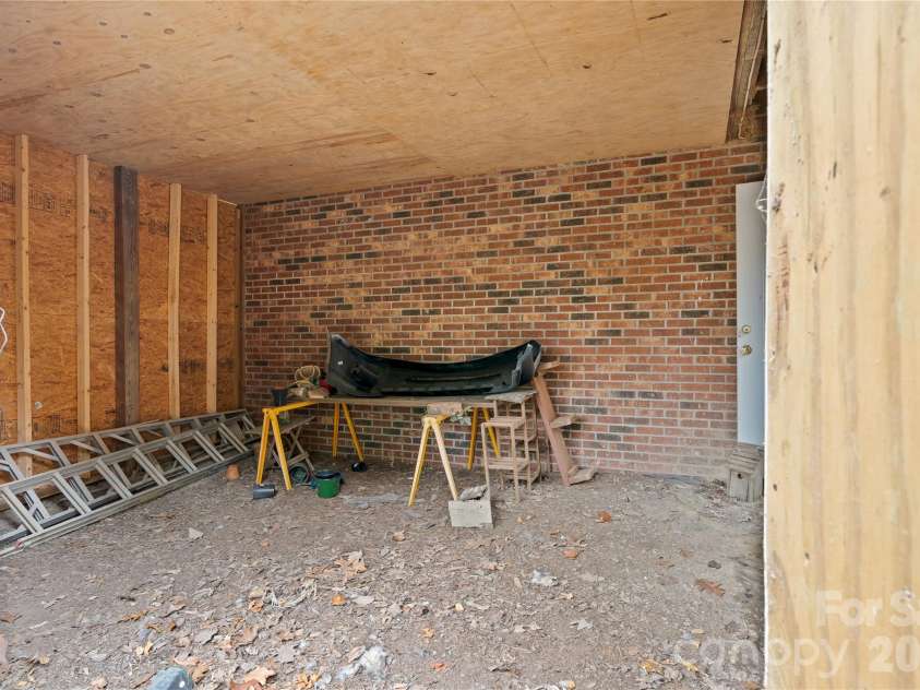 109 Eagle Rock Trail, Hendersonville, NC 28739.  MLS# CAR4353116, YatesRealty ID 6993. Lawn mower and yard tools storage