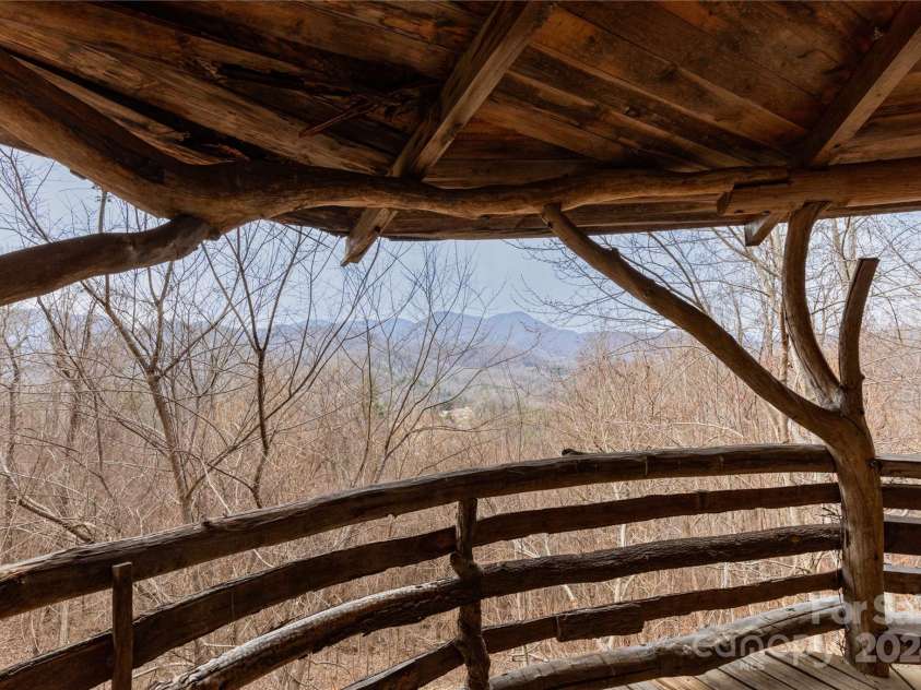 298 Turkey Creek Road, Leicester, NC 28748.  MLS# CAR4112849, YatesRealty ID 700. Wraparound Covered Porch