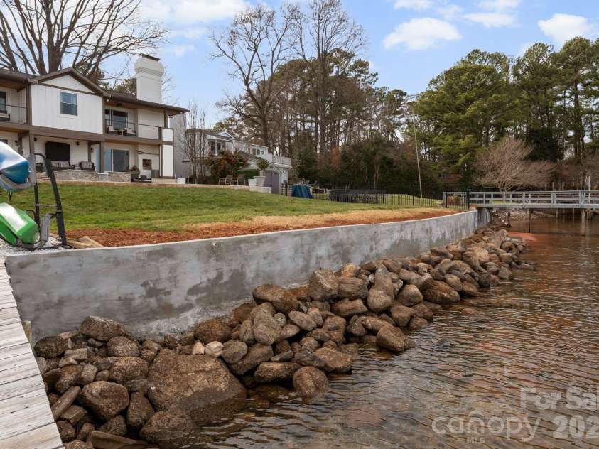 20732 Eastpoint Drive, Cornelius, NC 28031.  MLS# CAR4340192, YatesRealty ID 7002. Brand New Seawall!
