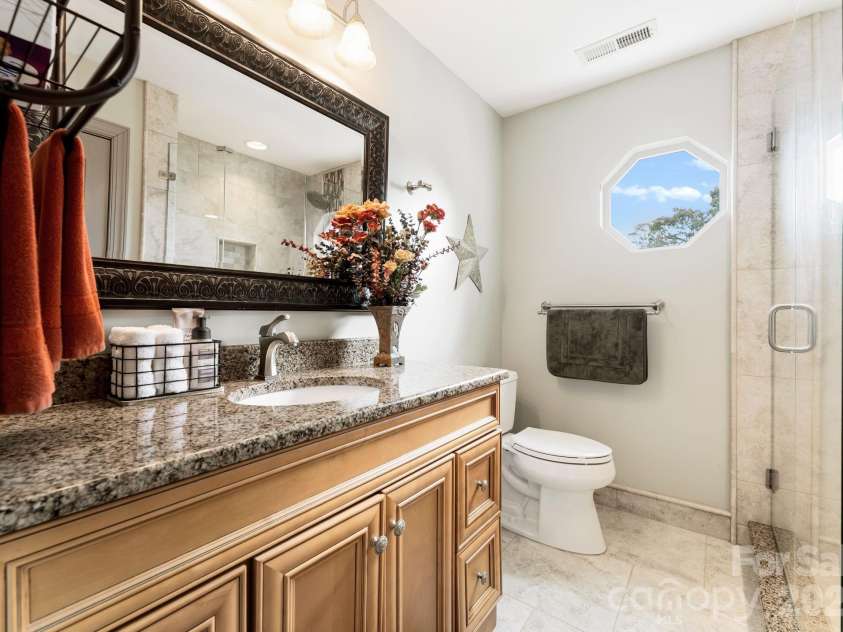 20732 Eastpoint Drive, Cornelius, NC 28031.  MLS# CAR4340192, YatesRealty ID 7002. Guest Bathroom