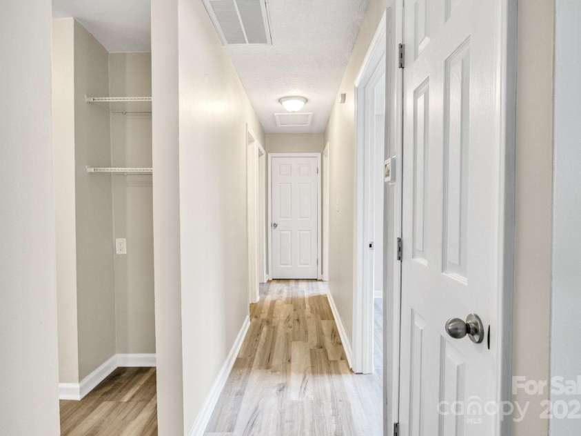2801 Alleghany Street, Charlotte, NC 28208.  MLS# CAR4239718, YatesRealty ID 7009. Hallway connecting bedrooms/home.