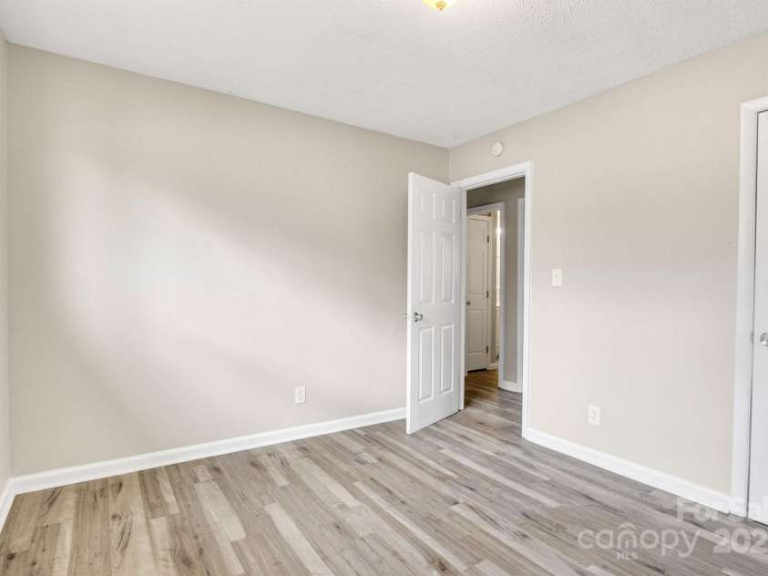 2801 Alleghany Street, Charlotte, NC 28208.  MLS# CAR4239718, YatesRealty ID 7009. Primary bedroom facing entry door.