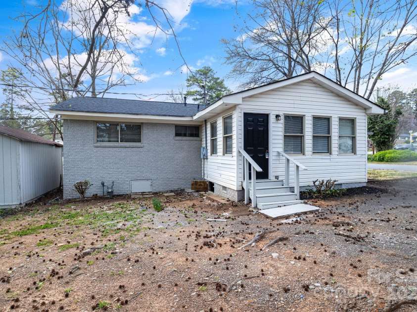 2801 Alleghany Street, Charlotte, NC 28208.  MLS# CAR4239718, YatesRealty ID 7009. Rear of home, emphasis on sunroom and rear exit door.