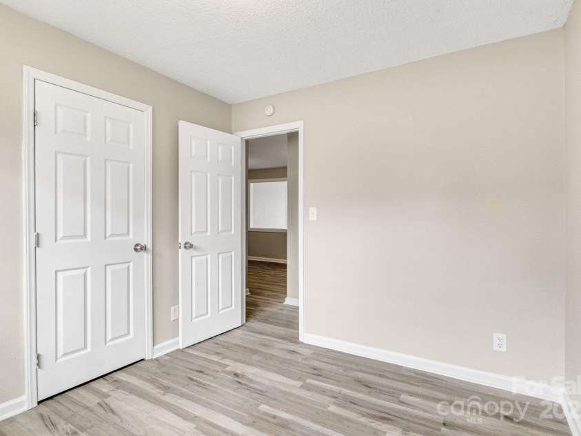 2801 Alleghany Street, Charlotte, NC 28208.  MLS# CAR4239718, YatesRealty ID 7009. Second bedroom facing entry door.