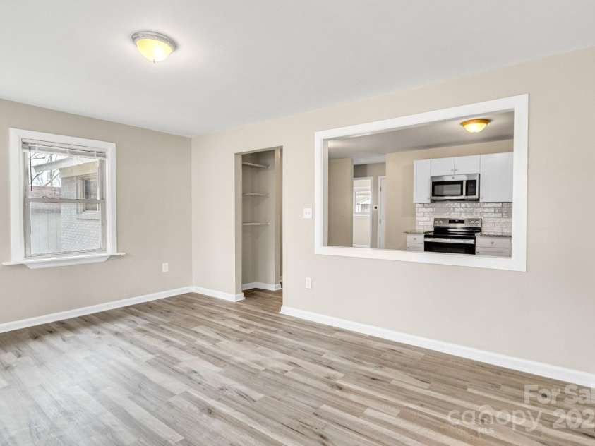 2801 Alleghany Street, Charlotte, NC 28208.  MLS# CAR4239718, YatesRealty ID 7009. Shot of sunroom, showing how kitchen is directly connected.