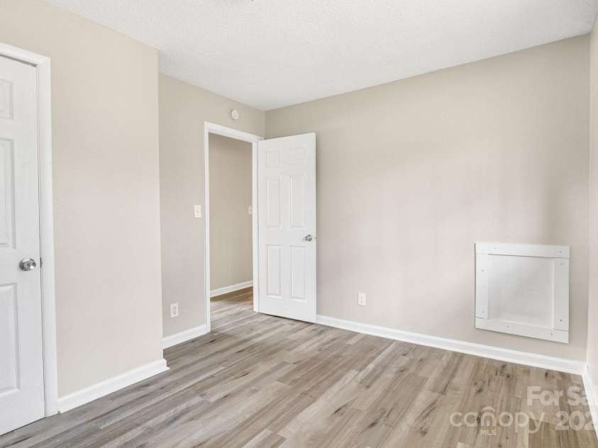 2801 Alleghany Street, Charlotte, NC 28208.  MLS# CAR4239718, YatesRealty ID 7009. Third shot of first bedroom, facing entry door.