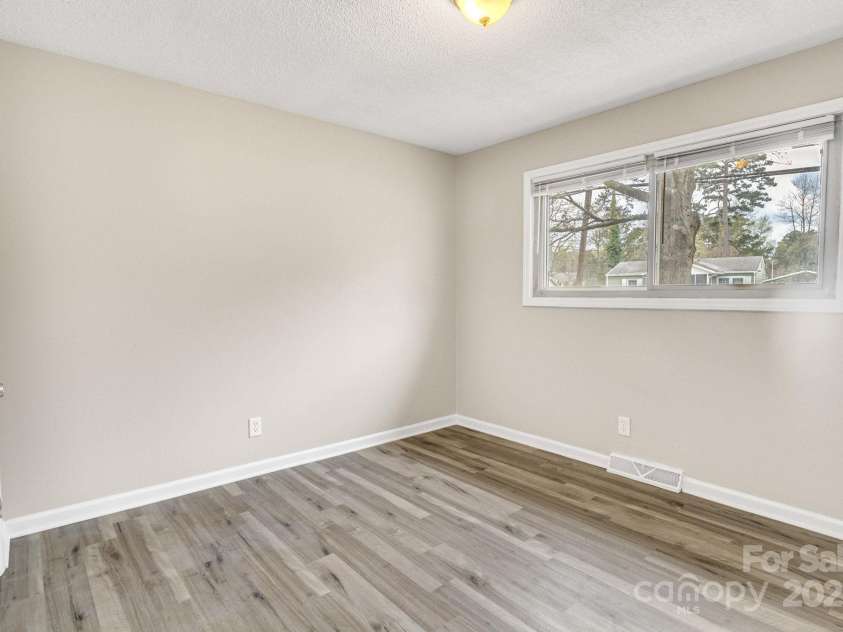 2801 Alleghany Street, Charlotte, NC 28208.  MLS# CAR4239718, YatesRealty ID 7009. Walking into primary bedroom.