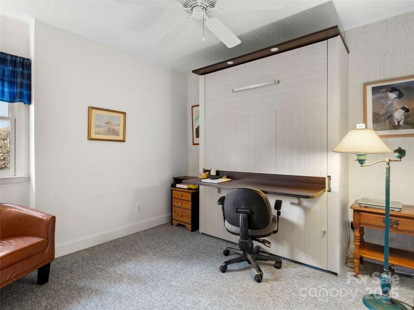 376 Ox Creek Road, Weaverville, NC 28787.  MLS# CAR4241579, YatesRealty ID 7011. Lower level 2nd bedroom: Murphy bed
