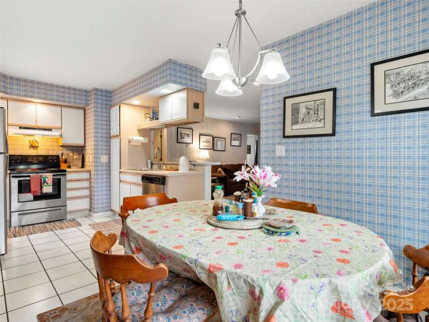 376 Ox Creek Road, Weaverville, NC 28787.  MLS# CAR4241579, YatesRealty ID 7011. Lower level dining