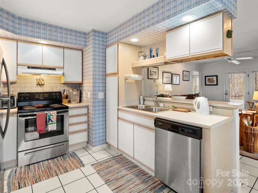 376 Ox Creek Road, Weaverville, NC 28787.  MLS# CAR4241579, YatesRealty ID 7011. Lower level kitchen