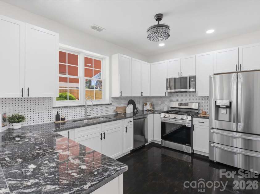 7702 Harrington Woods Road, Charlotte, NC 28269.  MLS# CAR4362387, YatesRealty ID 7016. 