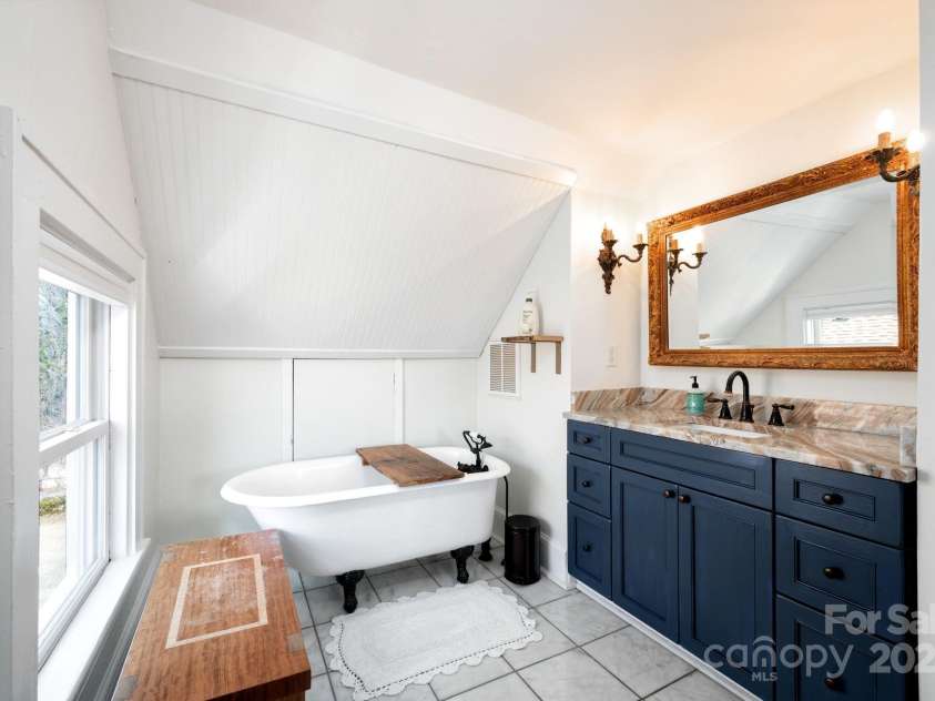 22 Broad Street, Asheville, NC 28801.  MLS# CAR4232987, YatesRealty ID 7019. Granite-Topped Vanity and Soaking Tub