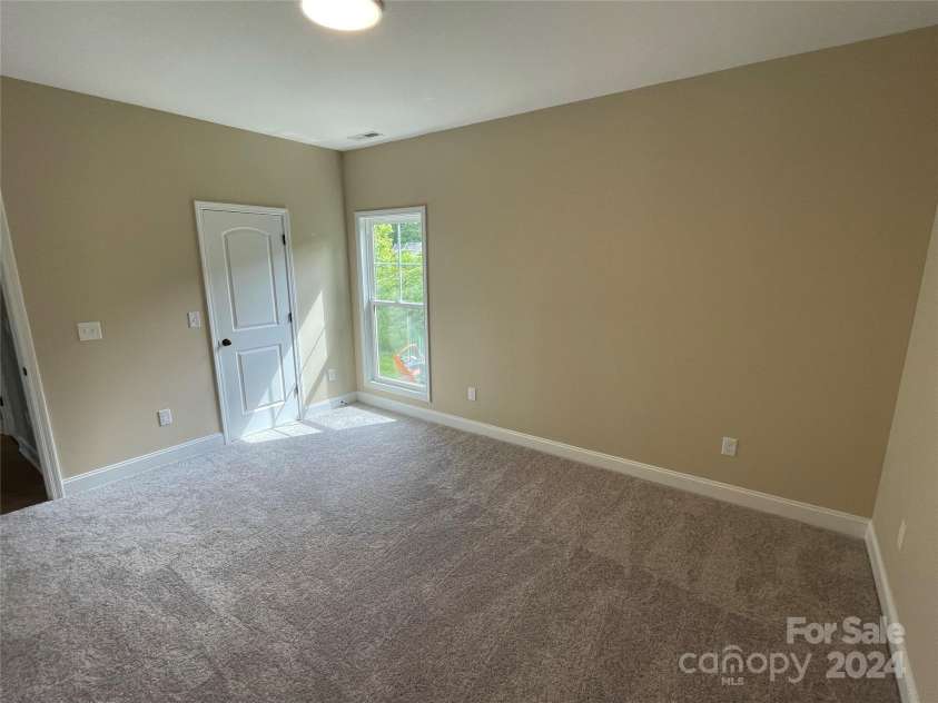373 Barefoot Ridge, Clyde, NC 28721.  MLS# CAR4119628, YatesRealty ID 702. Primary bedroom