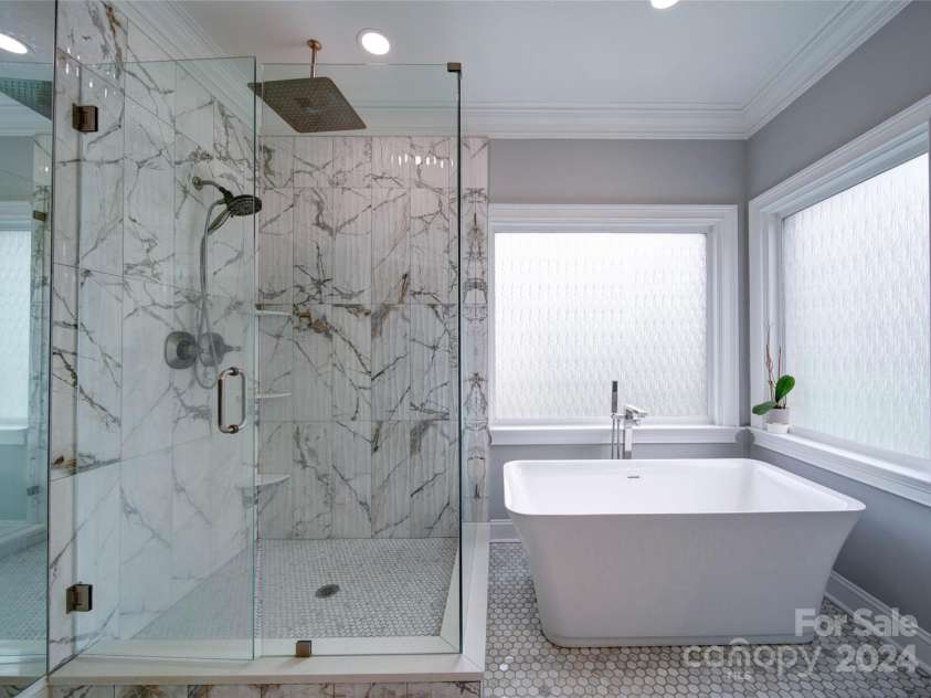 119 Plantation Drive, Mooresville, NC 28117.  MLS# CAR4198986, YatesRealty ID 7020. Frameless Rain Shower with Separate Garden Tub.  Notice the Beautiful Tile
