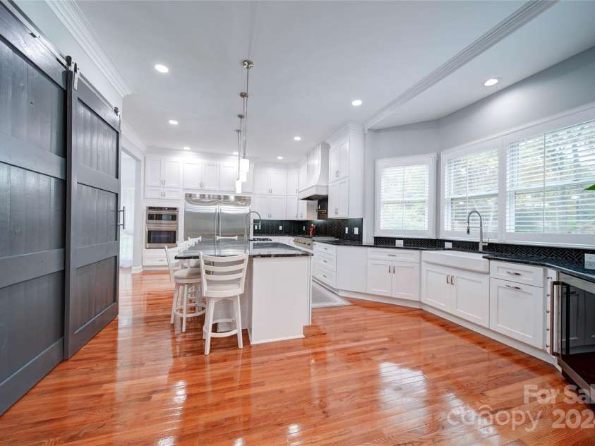 119 Plantation Drive, Mooresville, NC 28117.  MLS# CAR4198986, YatesRealty ID 7020. Long Pantry with Barn Doors