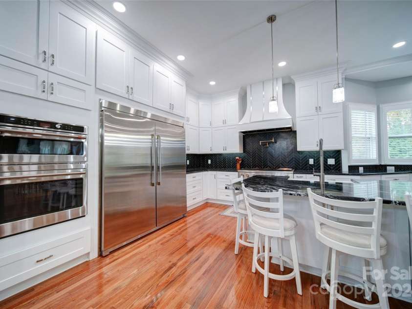 119 Plantation Drive, Mooresville, NC 28117.  MLS# CAR4198986, YatesRealty ID 7020. Stainless Steel Appliances with Custom Cabinets and Custom Hood Range Venting to Outside
