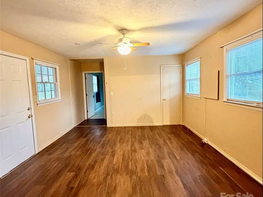 9 Riddle Road, Swannanoa, NC 28778.  MLS# CAR4329684, YatesRealty ID 7020. Den coming in from kitchen