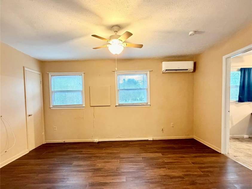 9 Riddle Road, Swannanoa, NC 28778.  MLS# CAR4329684, YatesRealty ID 7020. Den when walking in front door