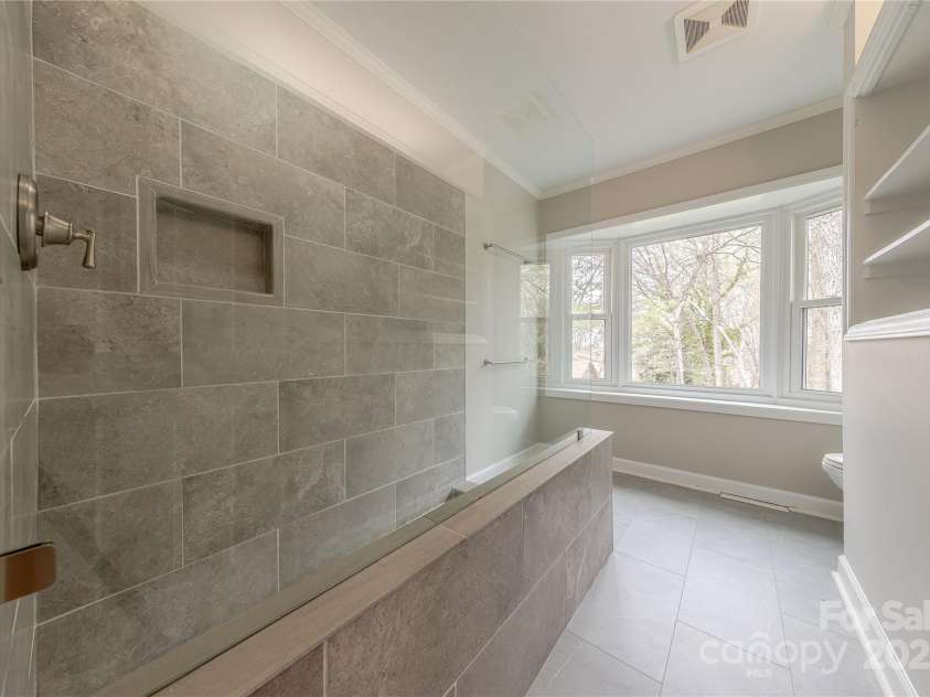 10101 Woodview Circle, Charlotte, NC 28277.  MLS# CAR4233546, YatesRealty ID 7021. Glass Enclosed Tile Shower
