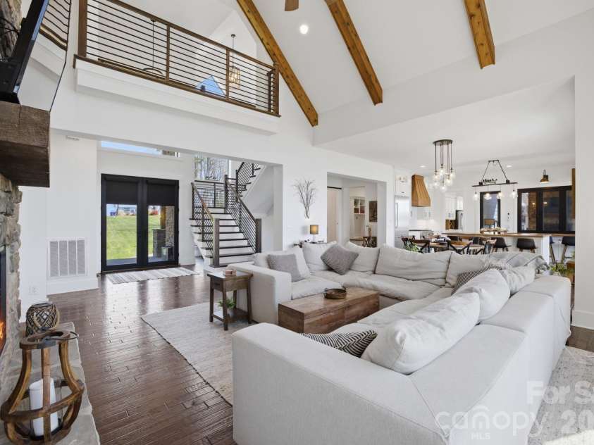 7748 Harbor Lane, Denver, NC 28037.  MLS# CAR4357257, YatesRealty ID 7022. Striking entry with vaulted ceilings, exposed beams, and immediate water views