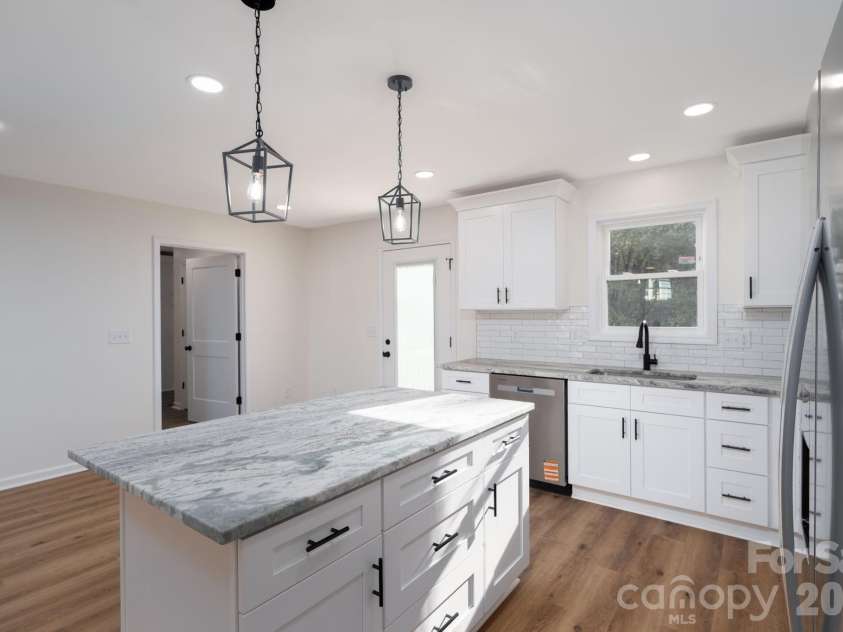 1928 Noles Circle, Lincolnton, NC 28092.  MLS# CAR4359715, YatesRealty ID 7023. Kitchen with dining area and access to back deck
