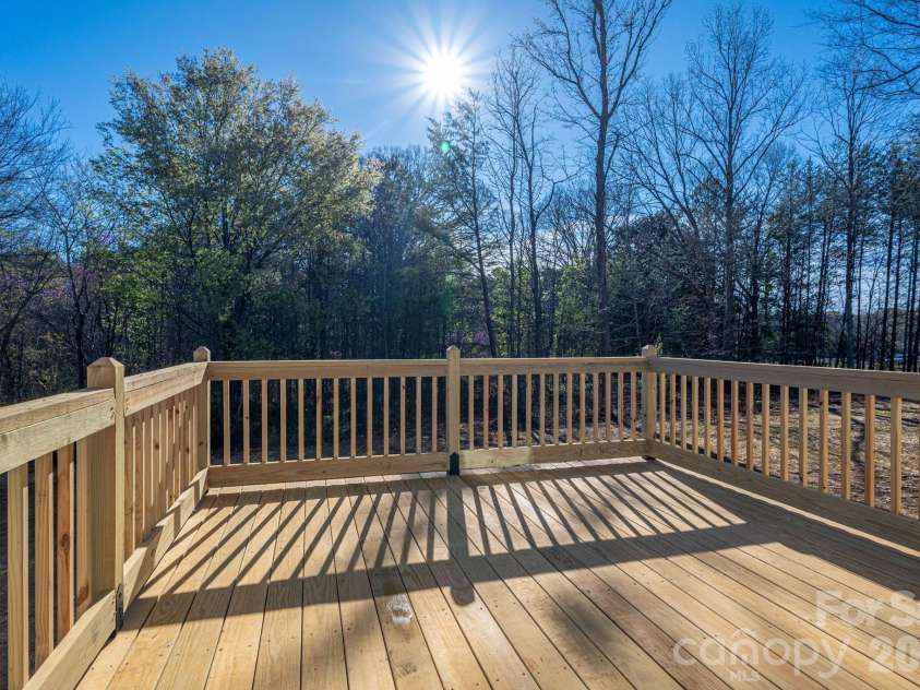 1928 Noles Circle, Lincolnton, NC 28092.  MLS# CAR4359715, YatesRealty ID 7023. View from deck.  Woods bordering yard