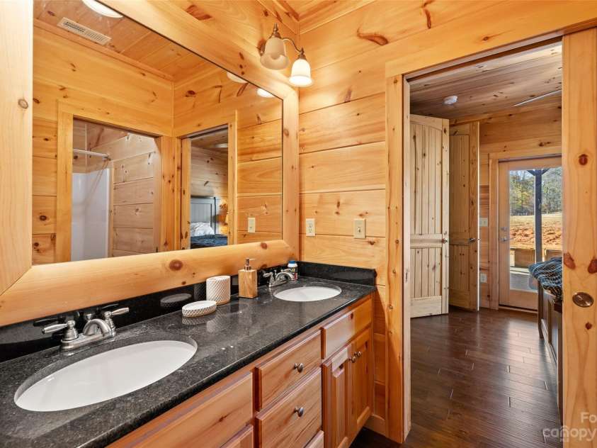 1642 Smith Waldrop Road, Mill Spring, NC 28756.  MLS# CAR4089037, YatesRealty ID 7026. Lower Level Jack Jill Bath