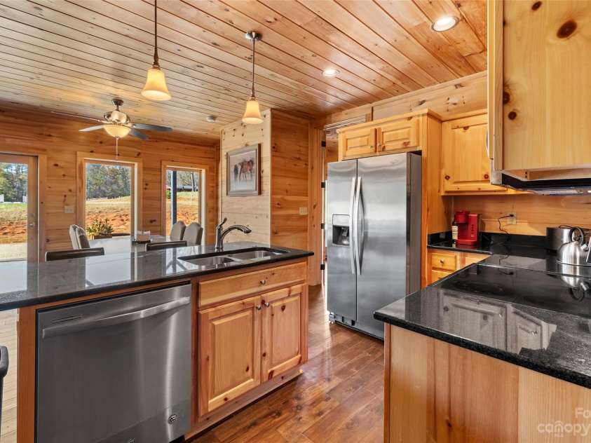 1642 Smith Waldrop Road, Mill Spring, NC 28756.  MLS# CAR4089037, YatesRealty ID 7026. Lower Level Kitchen