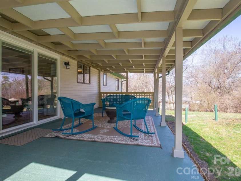 22 Stoney Nob Drive, Hendersonville, NC 28792.  MLS# CAR4354591, YatesRealty ID 7029. Covered rear patio view 3