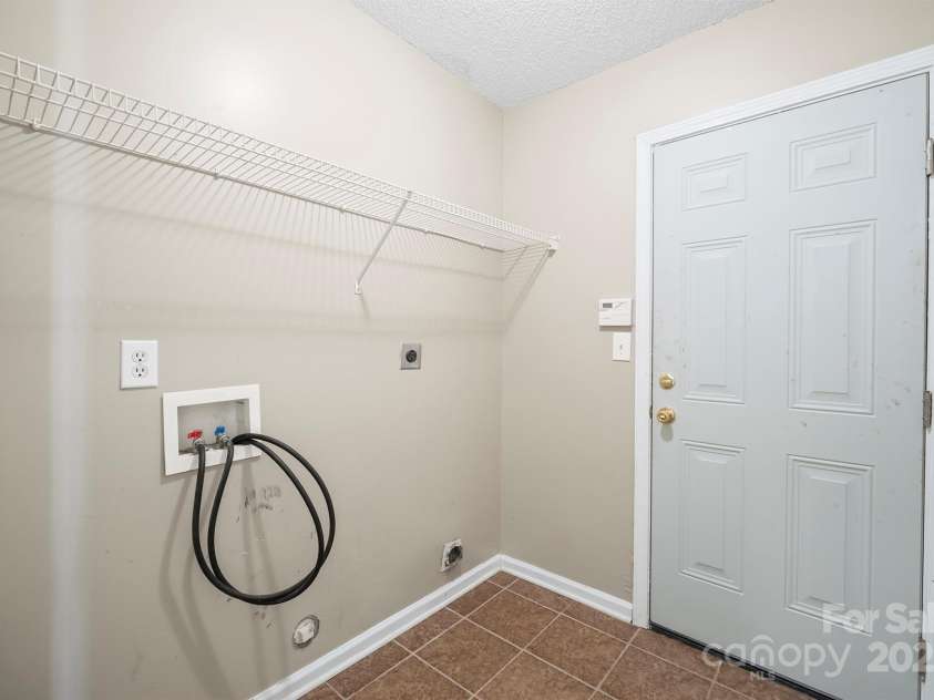 1838 Summit Ridge Lane, Kannapolis, NC 28083.  MLS# CAR4240108, YatesRealty ID 7030. Laundry room leading to garage