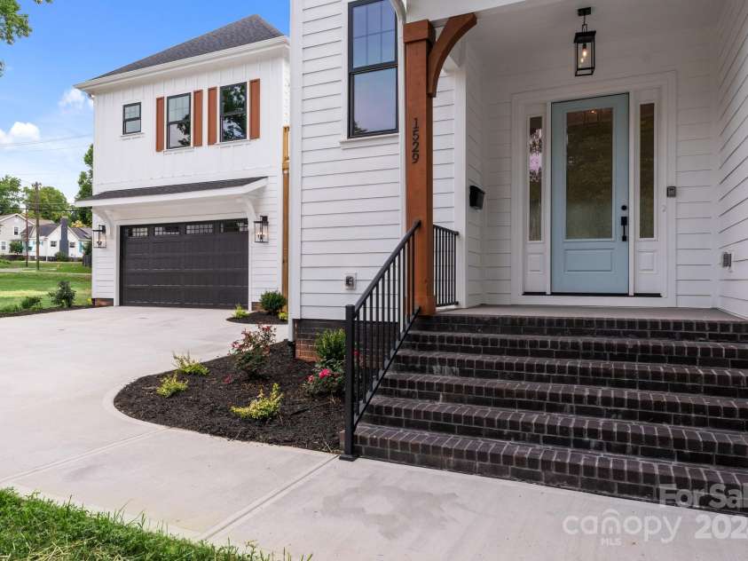 1529 Beckwith Place, Charlotte, NC 28205.  MLS# CAR4155227, YatesRealty ID 7036. Front Entry Main House/ view of extra living space above garage