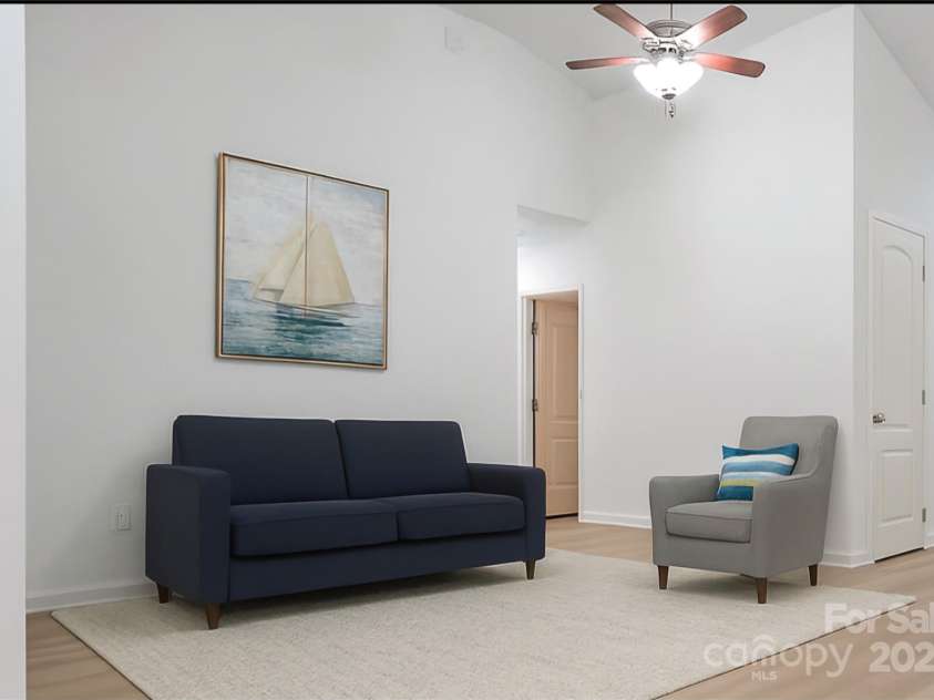 201 Tarrington Drive, Statesville, NC 28625.  MLS# CAR4293154, YatesRealty ID 704. Great room staged with AI