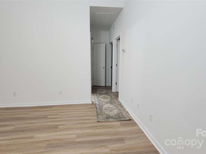 201 Tarrington Drive, Statesville, NC 28625.  MLS# CAR4293154, YatesRealty ID 704. Hallway to bedrooms two and three and second bath