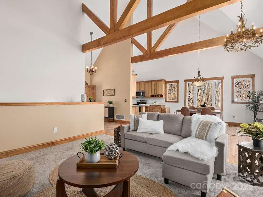 72 Wildflower Mountain Trail, Candler, NC 28715.  MLS# CAR4216852, YatesRealty ID 7043. Gorgeous exposed natural wood trusses accentuate tall ceilings in living areas