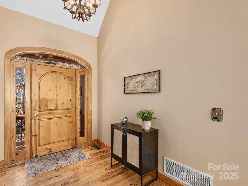 72 Wildflower Mountain Trail, Candler, NC 28715.  MLS# CAR4216852, YatesRealty ID 7043. Gracious entryway features custom solid wood front door