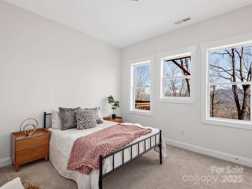 72 Wildflower Mountain Trail, Candler, NC 28715.  MLS# CAR4216852, YatesRealty ID 7043. Gracious second bedroom on lower level