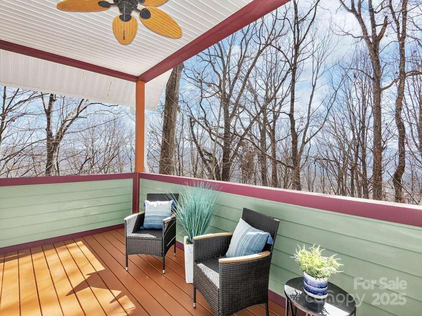72 Wildflower Mountain Trail, Candler, NC 28715.  MLS# CAR4216852, YatesRealty ID 7043. Serene primary suite deck with long range views