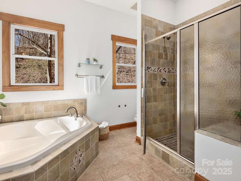 72 Wildflower Mountain Trail, Candler, NC 28715.  MLS# CAR4216852, YatesRealty ID 7043. Walk-in shower and jacuzzi tub