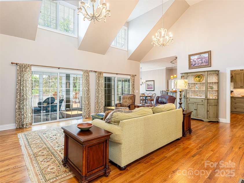 8 Hickory Ridge, Fletcher, NC 28732.  MLS# CAR4247492, YatesRealty ID 7046. Sun-drenched Living room connects to screen porch