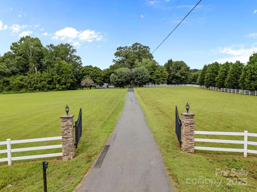 8900 Old Concord Road, Salisbury, NC 28146.  MLS# CAR4295325, YatesRealty ID 7046. Stately driveway to your new home