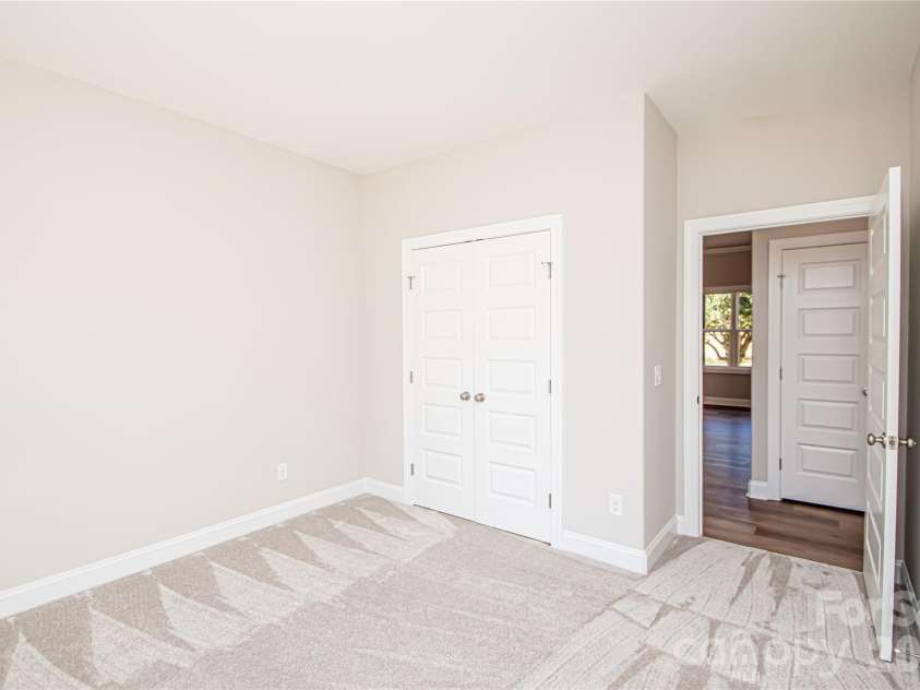 1508 Marion Street, Monroe, NC 28112.  MLS# CAR4315916, YatesRealty ID 7050. Spacious Bedroom #4 with plush carpet, large closet, oversized window, and convenient outlet ready for ceiling fan installation.