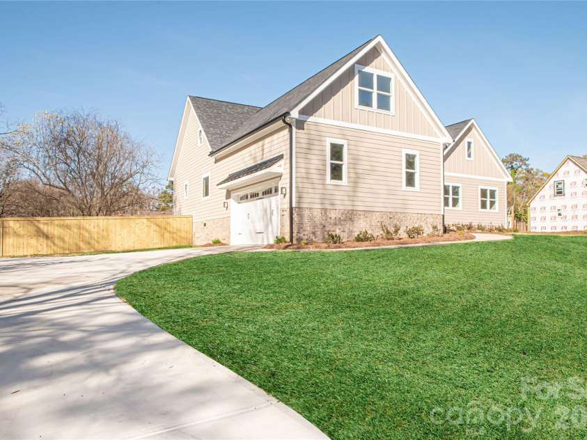 1508 Marion Street, Monroe, NC 28112.  MLS# CAR4315916, YatesRealty ID 7050. The long driveway offers ample additional parking and a convenient turnaround area, making it easy to get in and out of the garage.