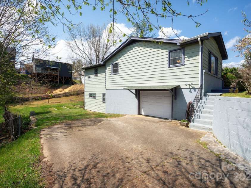 244 Bear Creek Road, Asheville, NC 28806.  MLS# CAR4243521, YatesRealty ID 7055. Ample Parking * Garage Access