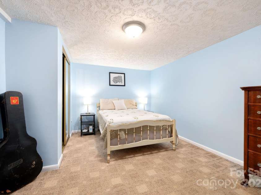 244 Bear Creek Road, Asheville, NC 28806.  MLS# CAR4243521, YatesRealty ID 7055. Basement Guest Bedroom