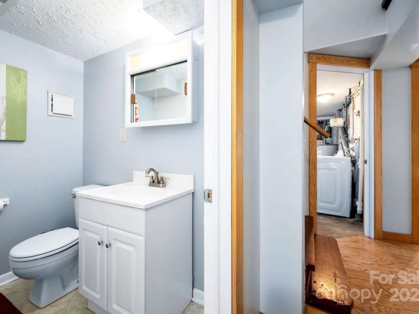 244 Bear Creek Road, Asheville, NC 28806.  MLS# CAR4243521, YatesRealty ID 7055. Convenient Half Guest Bathroom