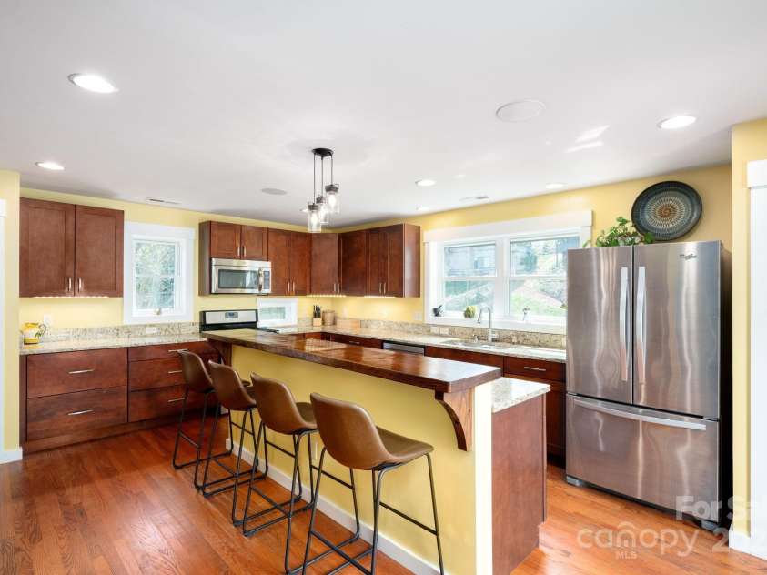 244 Bear Creek Road, Asheville, NC 28806.  MLS# CAR4243521, YatesRealty ID 7055. Large Breakfast Bar * Loads of Cabinetry